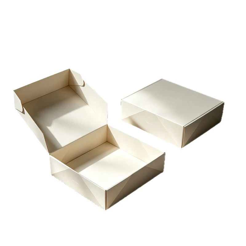 One open and one closed plain light-colored mailer box on a white background.