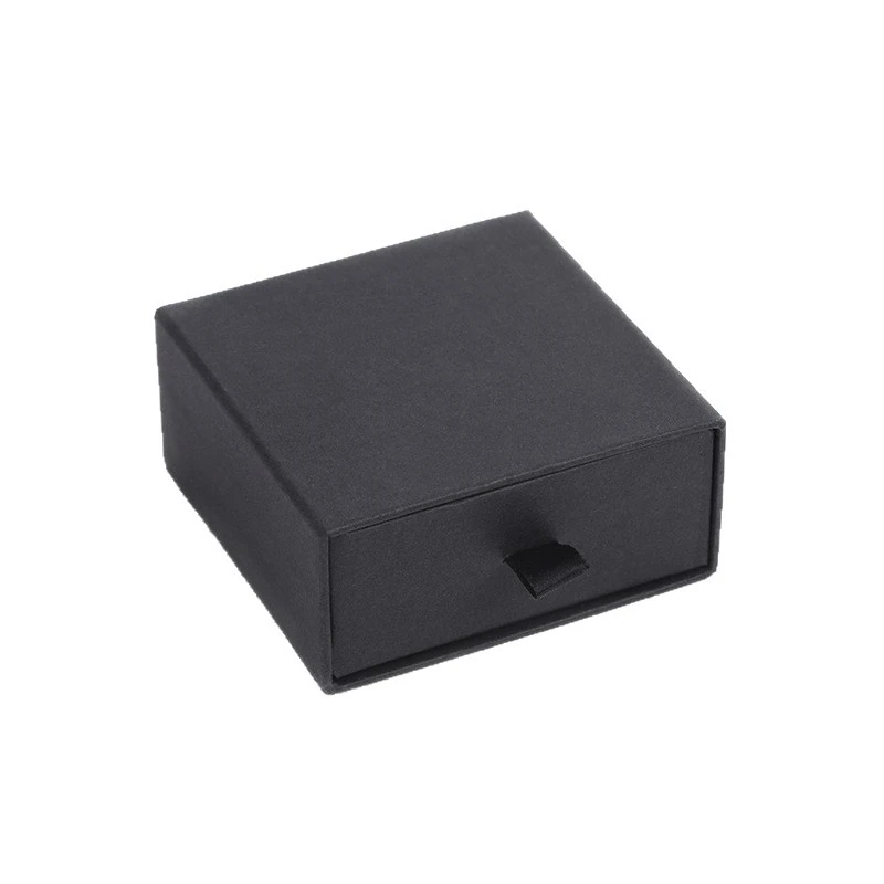 Closed black drawer-style presentation box with a visible front panel and short fabric pull tab.